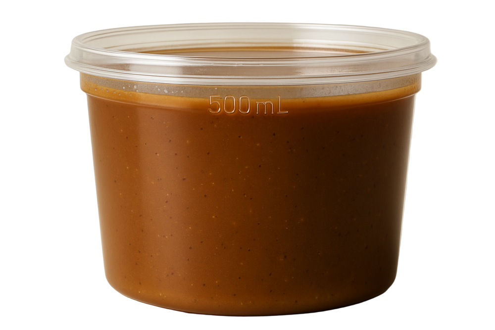 500 mL plastic transparent container frontal photo. the container is full of gravy. the camera is only 5 inches away from the container.